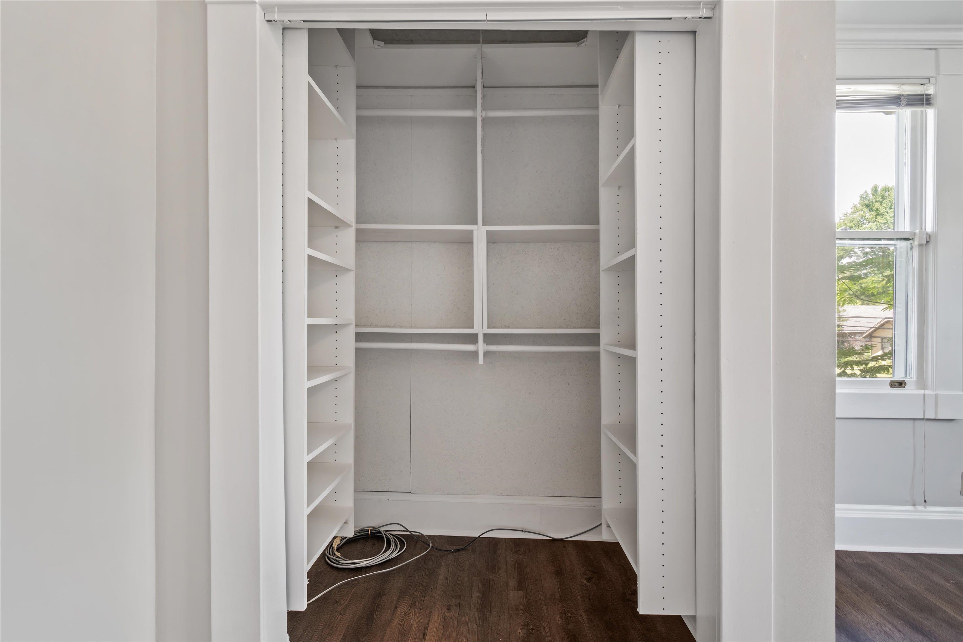 1983 Harbert Avenue Memphis, TN 38104 - Photo 23 of 40 a view of walk in closet with empty racks