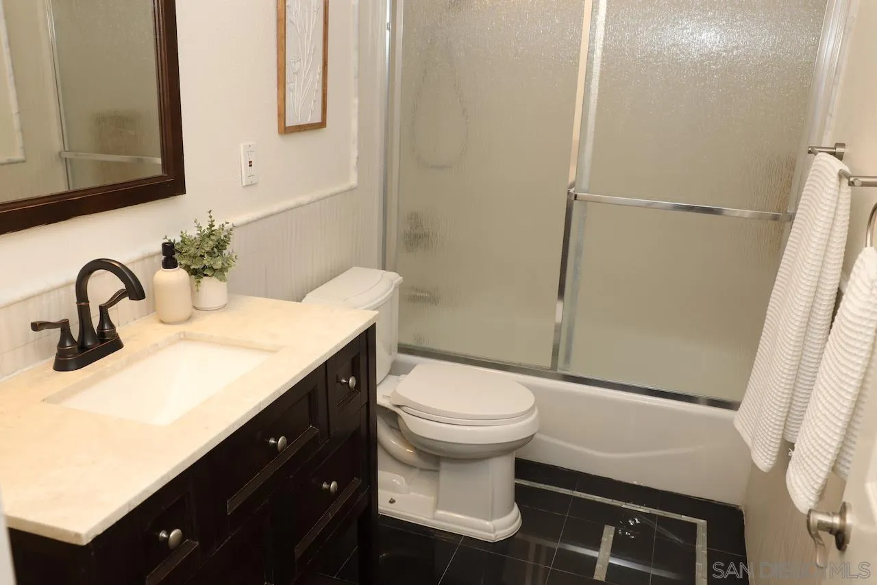 8907 Taurus Place San Diego, CA 92126 - Photo 20 of 40 a bathroom with a sink toilet and a mirror