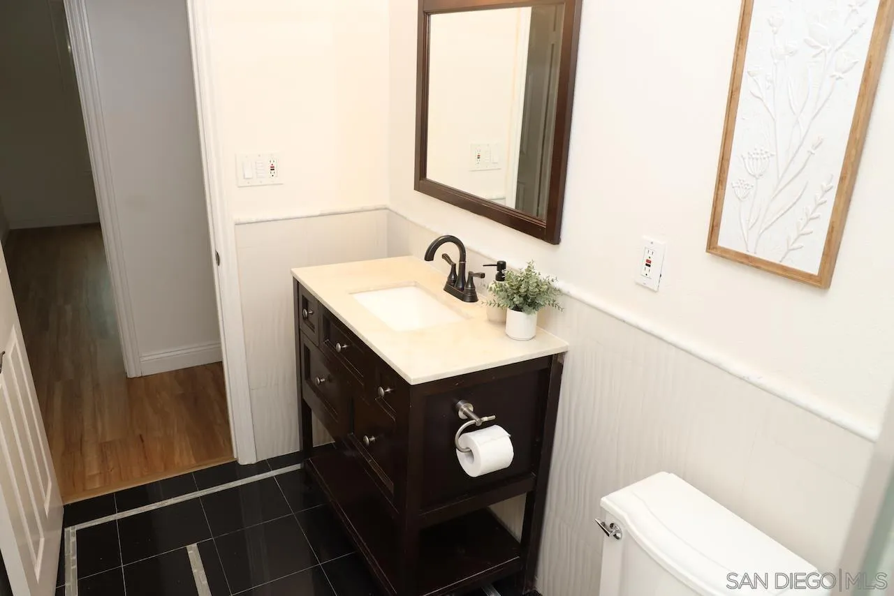 8907 Taurus Place San Diego, CA 92126 - Photo 21 of 40 a bathroom with a sink vanity and a toilet