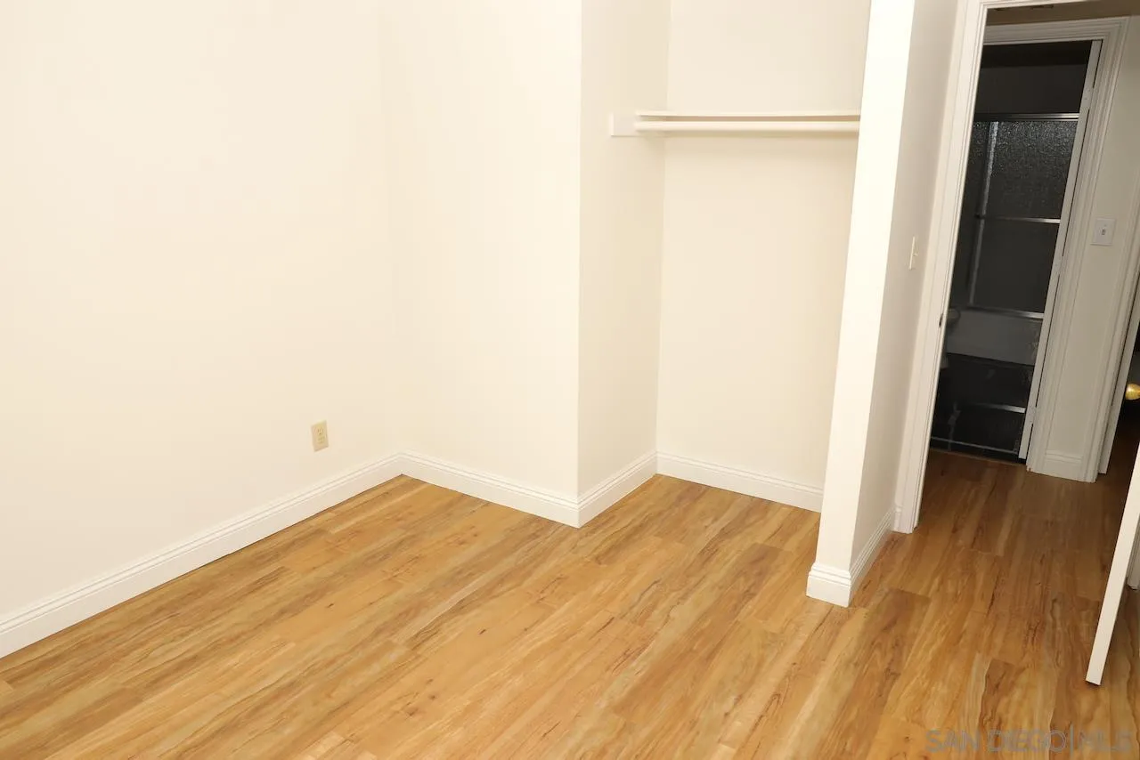 8907 Taurus Place San Diego, CA 92126 - Photo 25 of 40 a view of empty room with wooden floor