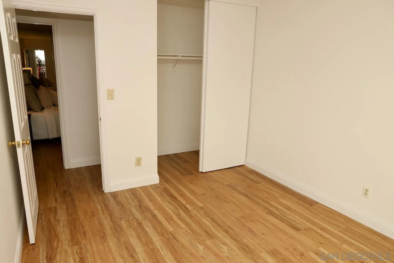 8907 Taurus Place San Diego, CA 92126 - Photo 26 of 40 a view of a room with wooden floor