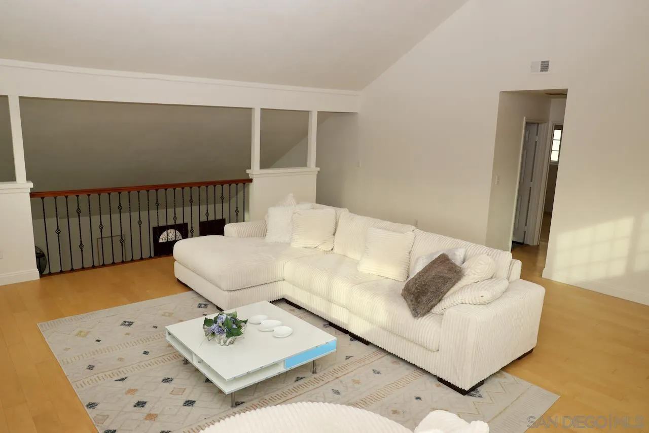 8907 Taurus Place San Diego, CA 92126 - Photo 29 of 40 a living room with furniture and wooden floor
