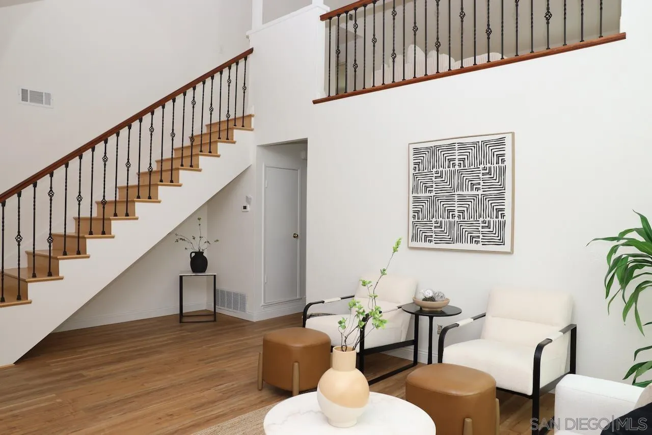 8907 Taurus Place San Diego, CA 92126 - Photo 4 of 40 a living room with couches with wooden floor and windows