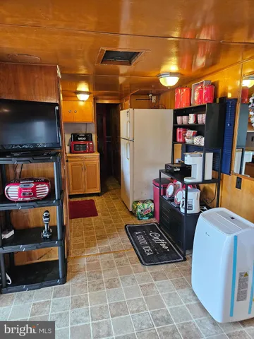 a kitchen with stainless steel appliances a sink a stove top oven a counter space and cabinets