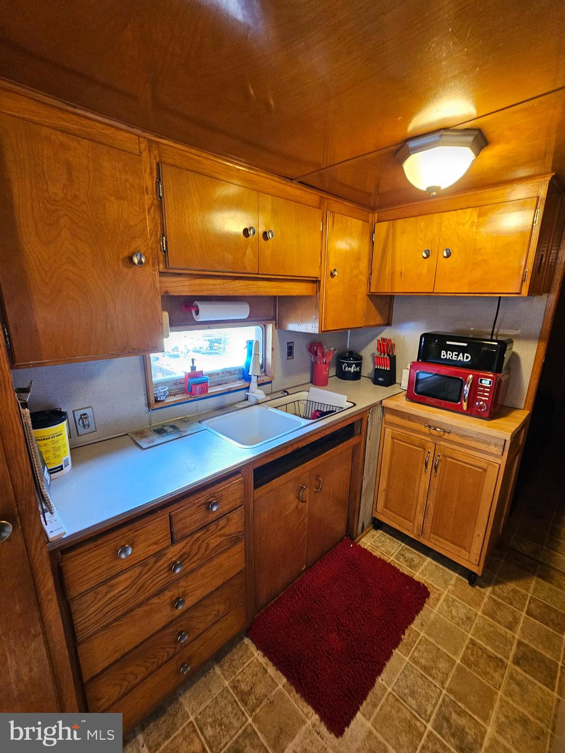 3 Park Boulevard Falling Waters, WV 25419 - Photo 13 of 34 a kitchen with stainless steel appliances a sink a stove top oven a counter space and cabinets