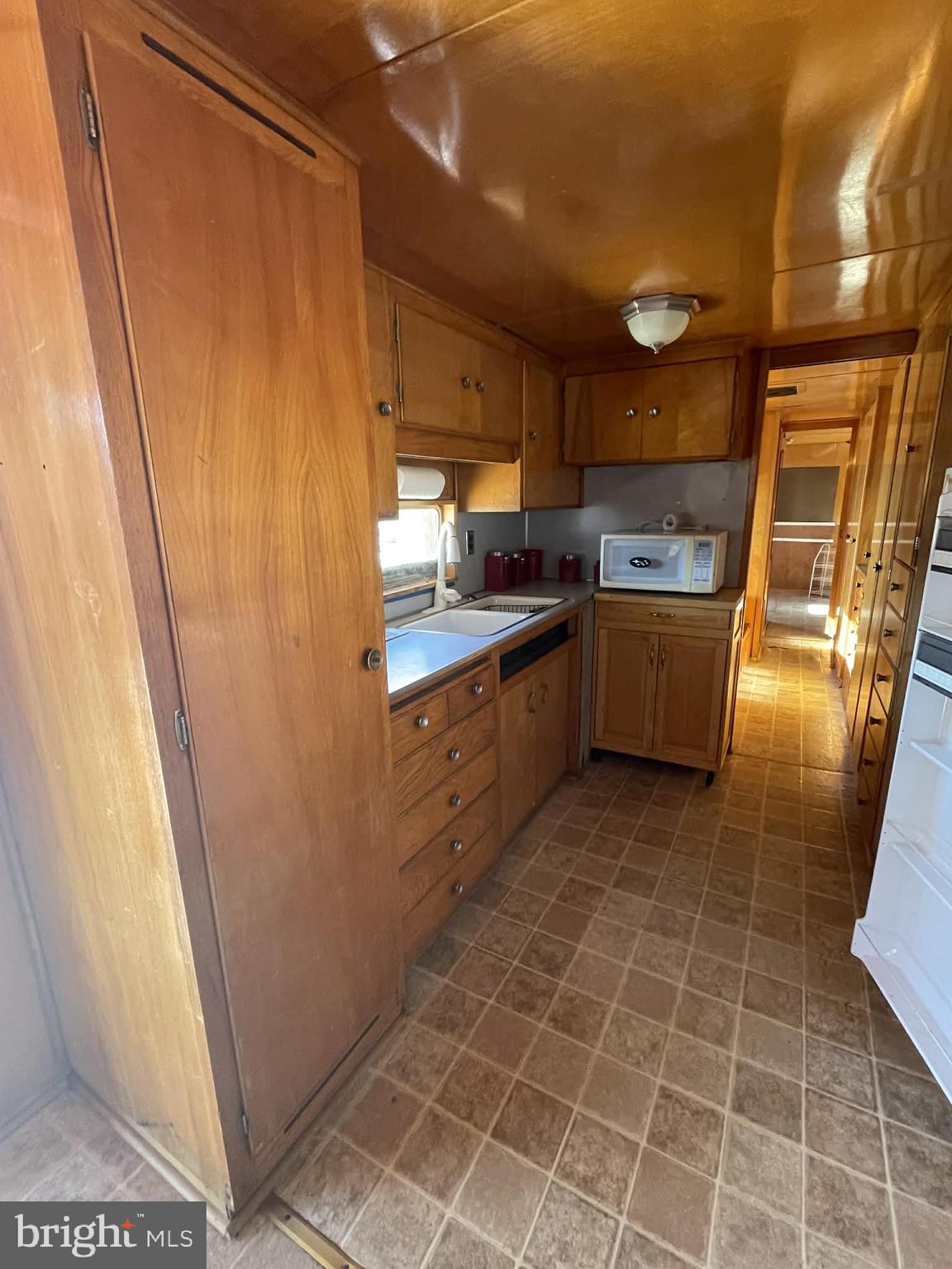 3 Park Boulevard Falling Waters, WV 25419 - Photo 15 of 42 a kitchen with granite countertop a sink a stove a refrigerator and window