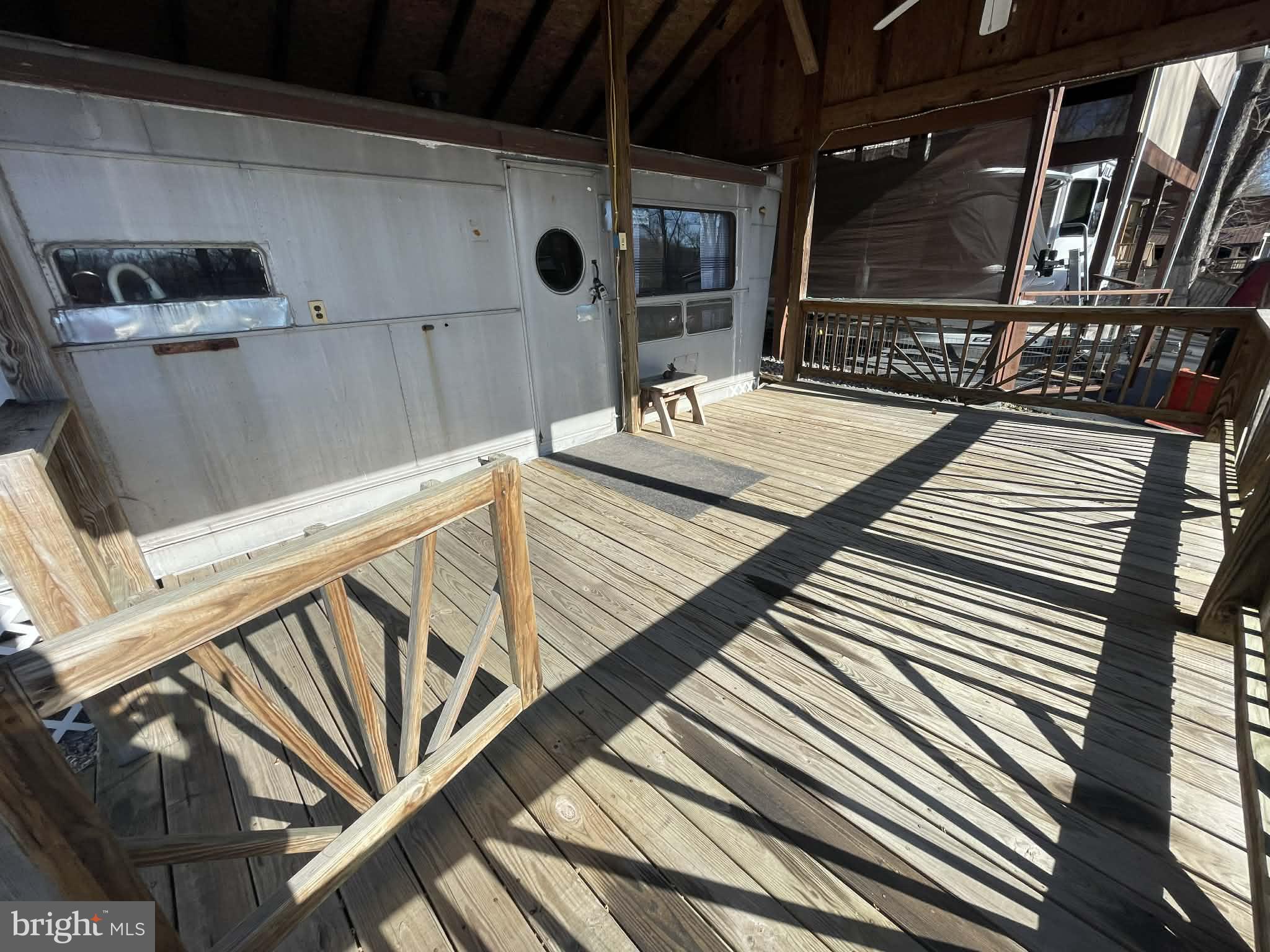 3 Park Boulevard Falling Waters, WV 25419 - Photo 5 of 42 a view of a balcony with chairs and wooden floor