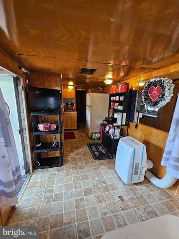 a kitchen with stainless steel appliances granite countertop a sink and wooden cabinets