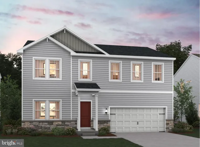 a front view of a house with garage