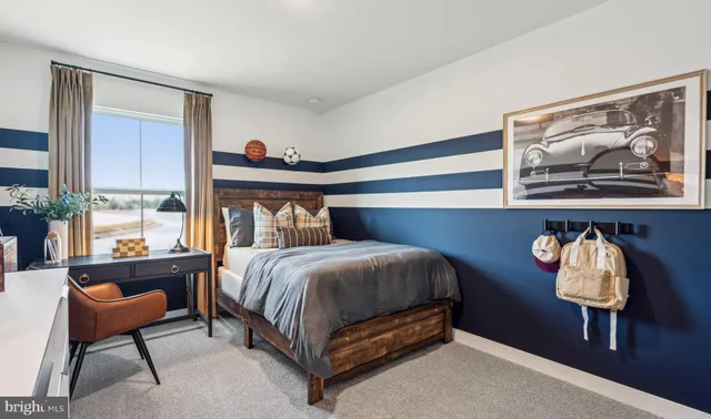 a bedroom with a bed and chair