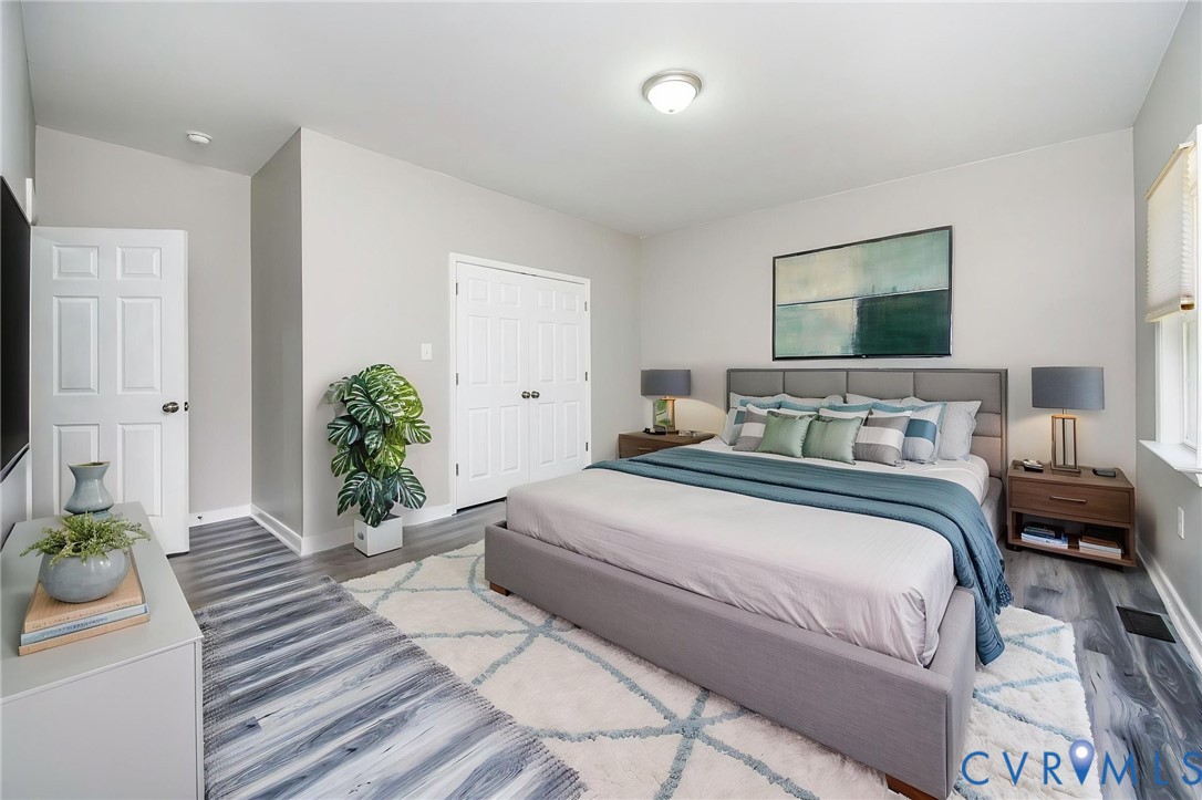 1297 Manfield Road Aylett, VA 23009 - Photo 2 of 41 a bedroom with bed and wooden floor
