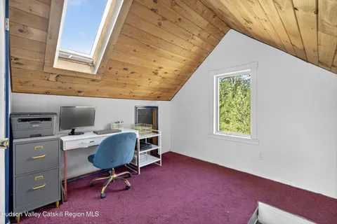 a view of a workspace with furniture