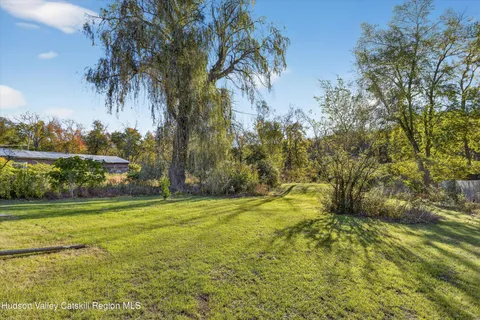 a view of a yard with an trees