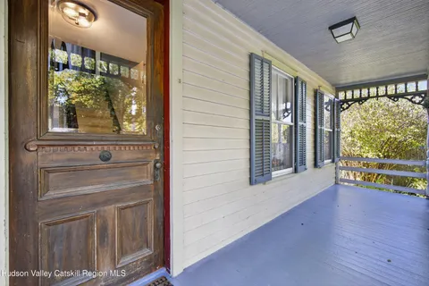 a view of an entryway with wooden floor and door