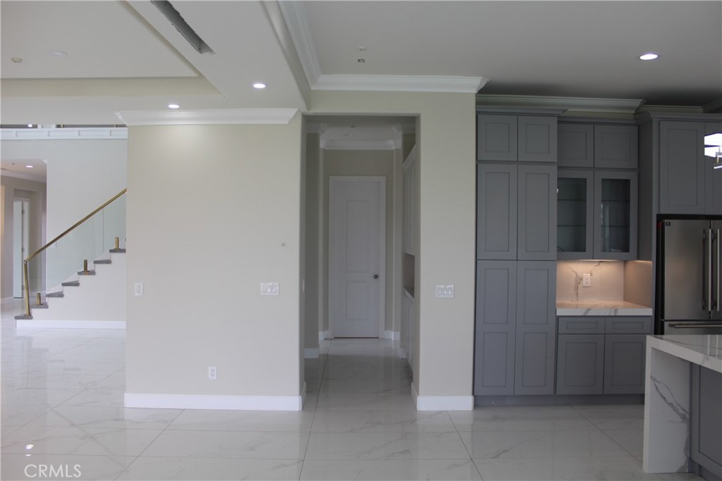 6318 Echo Mountain Rancho Cucamonga, CA 91739 - Photo 24 of 25 a view of a kitchen with a refrigerator and a sink