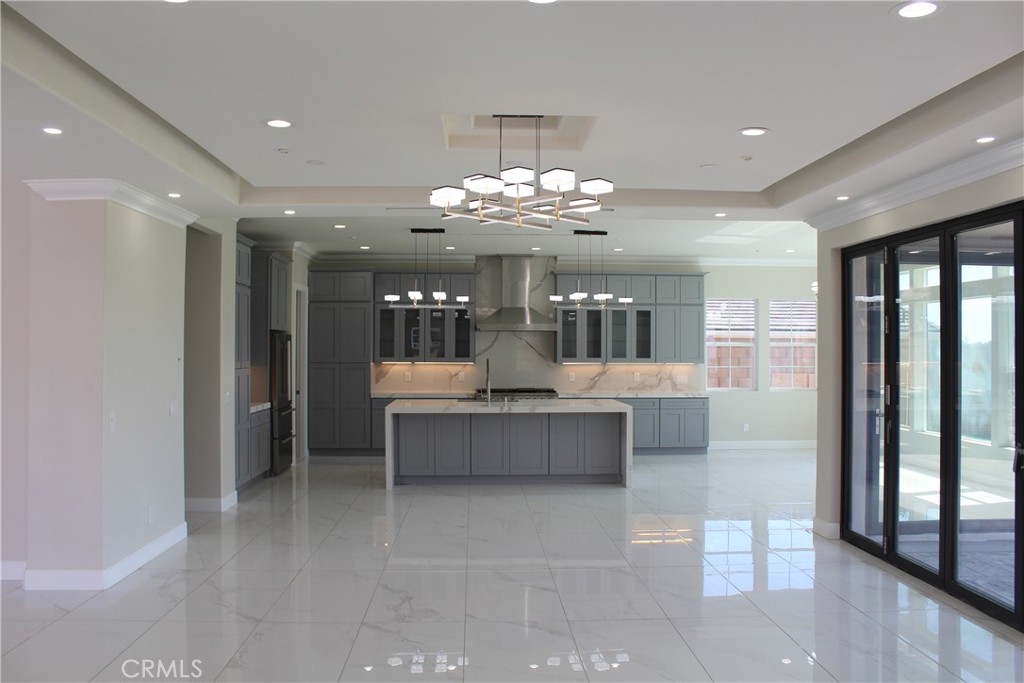 6318 Echo Mountain Rancho Cucamonga, CA 91739 - Photo 7 of 25 a view of a dining room with furniture and chandelier