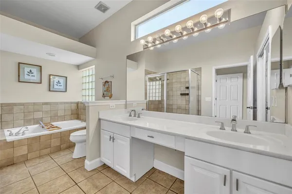 a bathroom with a shower and a sink