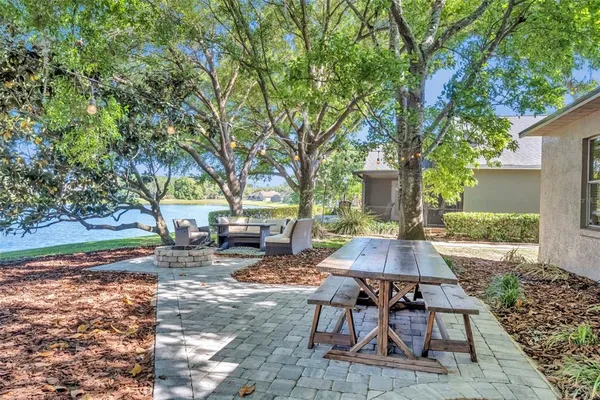 a view of a yard with table and chairs