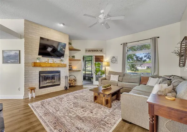 a living room with furniture and a fireplace