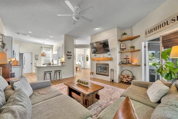 a living room with furniture and a fireplace