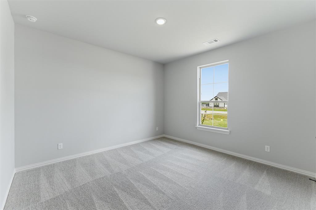 137 Moss Gln Lane Rhome, TX 76078 - Photo 17 of 25 an empty room with a window