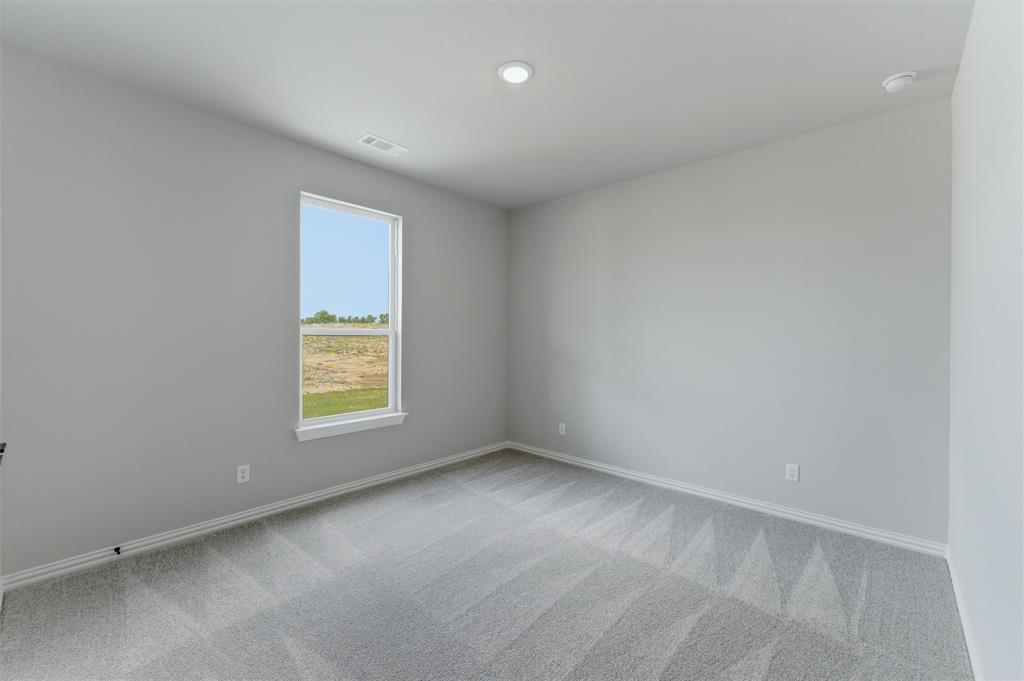 137 Moss Gln Lane Rhome, TX 76078 - Photo 19 of 25 an empty room with a window