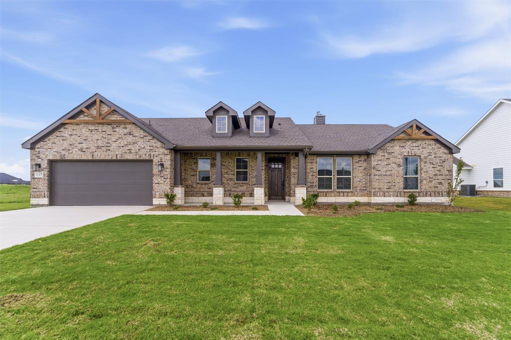 137 Moss Gln Lane Rhome, TX 76078 - Photo 2 of 25 a front view of a house with swimming pool having outdoor seating