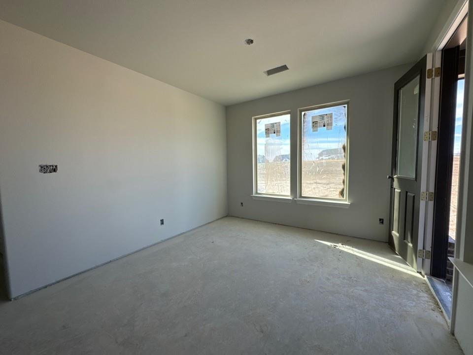 137 Moss Gln Lane Rhome, TX 76078 - Photo 6 of 12 an empty room with windows