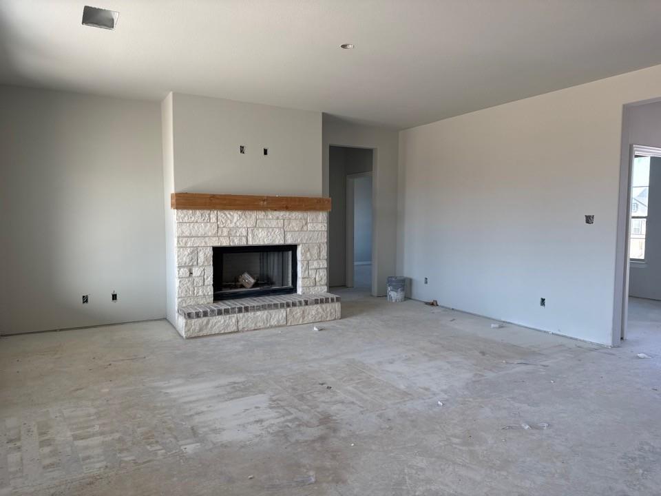 137 Moss Gln Lane Rhome, TX 76078 - Photo 9 of 12 an empty room with a fireplace