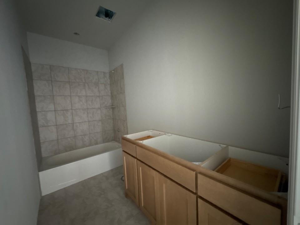 137 Moss Gln Lane Rhome, TX 76078 - Photo 10 of 12 a bathroom with a sink and a bathtub