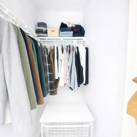 a white toilet sitting next to a bath tub