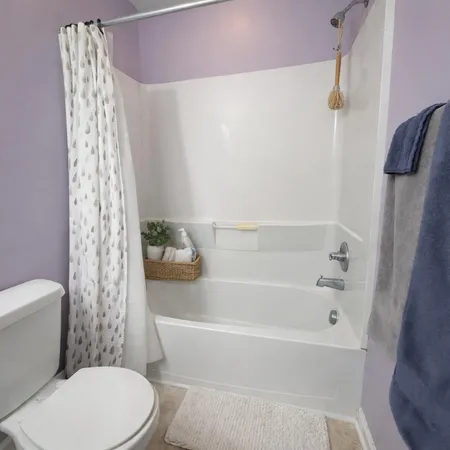 a kitchen with a sink a toilet and a mirror