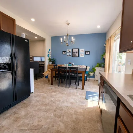 a view of a dining room with furniture window and outside view