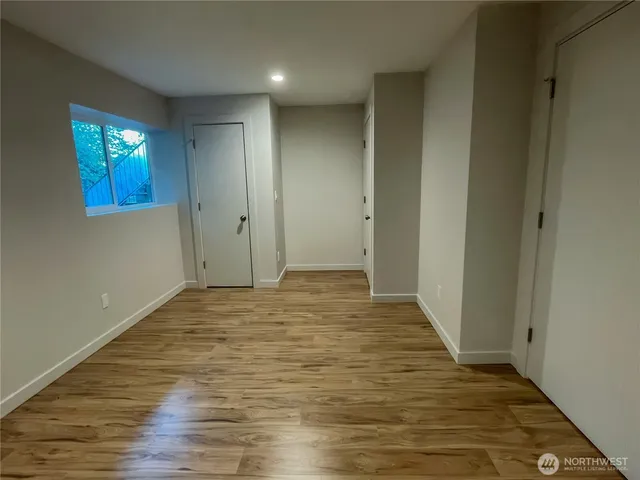 a bathroom with a sink a toilet a mirror and shower