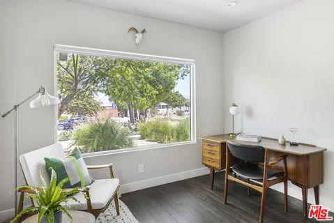 a workspace with furniture and a window