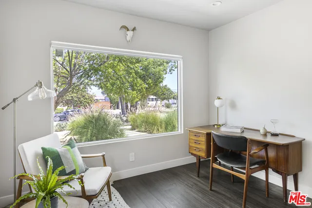 a workspace with furniture and a window