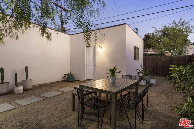 a view of an outdoor space with a table and chairs