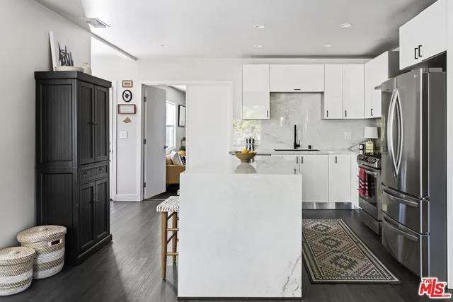 a kitchen with a refrigerator a sink and dishwasher