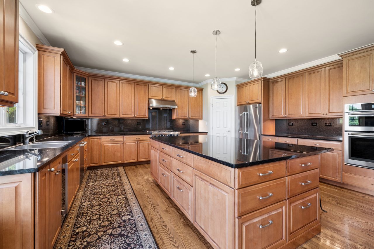 1029 Ridgeview Drive Inverness, IL 60010 - Photo 15 of 58 a large kitchen with stainless steel appliances granite countertop a stove a sink and a refrigerator