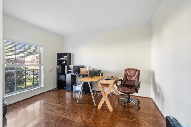 a work room with furniture and a window