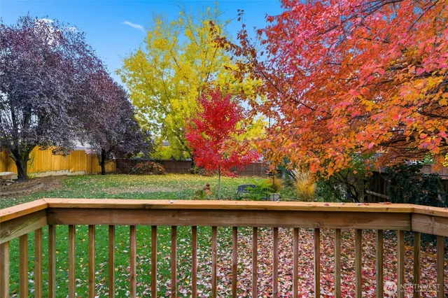 a view of a wooden deck and a yard