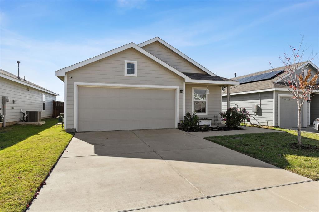 5513 Berea Street Forney, TX 75126 - Photo 2 of 29 The driveway is perfect for extra cars or kids to play.