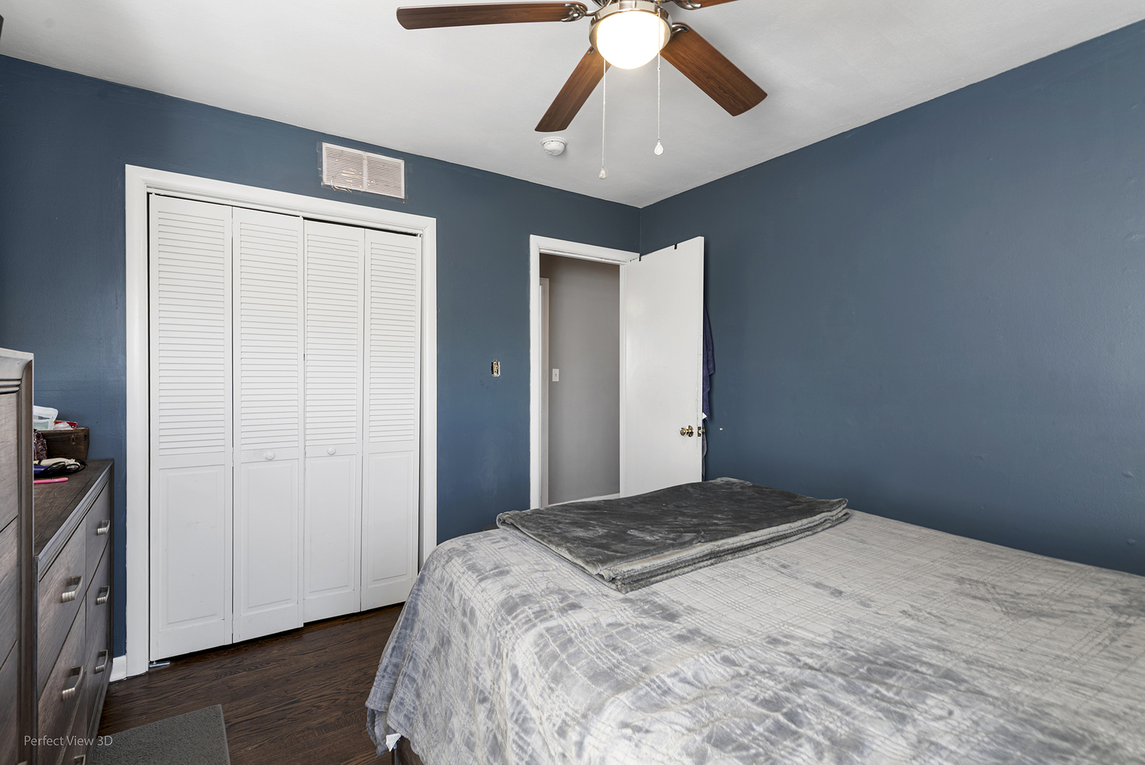 9007 Ridgeland Avenue Oak Lawn, IL 60453 - Photo 14 of 22 a bedroom with a bed and a chandelier