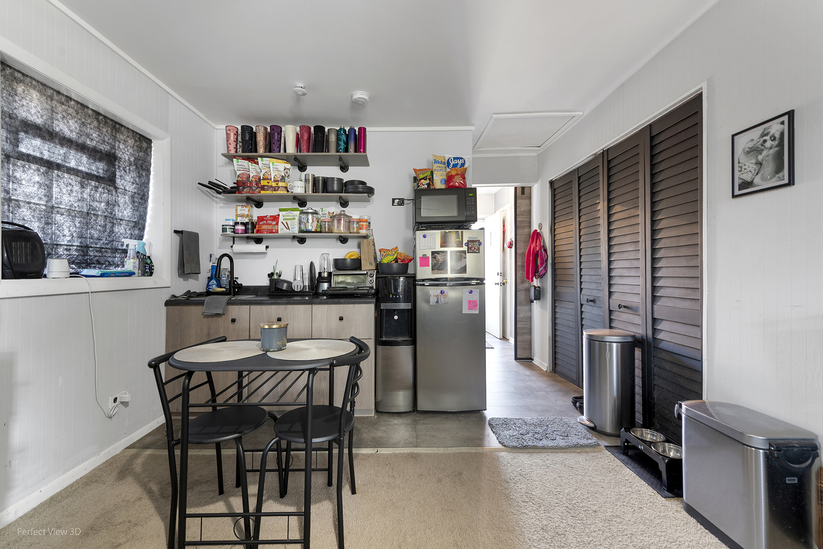 9007 Ridgeland Avenue Oak Lawn, IL 60453 - Photo 15 of 22 a view of kitchen with stainless steel appliances granite countertop dining table and chairs