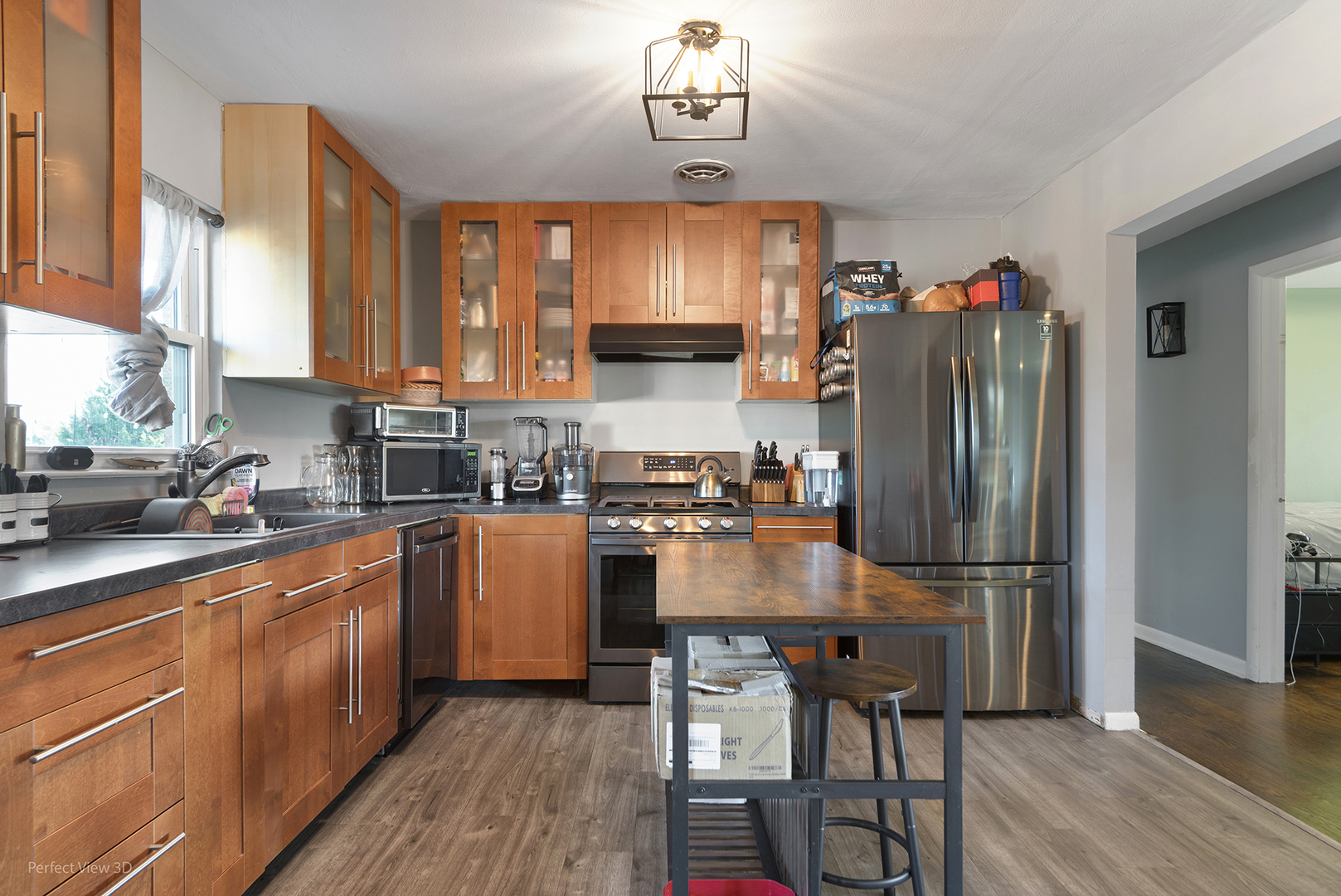 9007 Ridgeland Avenue Oak Lawn, IL 60453 - Photo 9 of 22 a kitchen with stainless steel appliances granite countertop a refrigerator a sink dishwasher a stove and white countertops with wooden floor