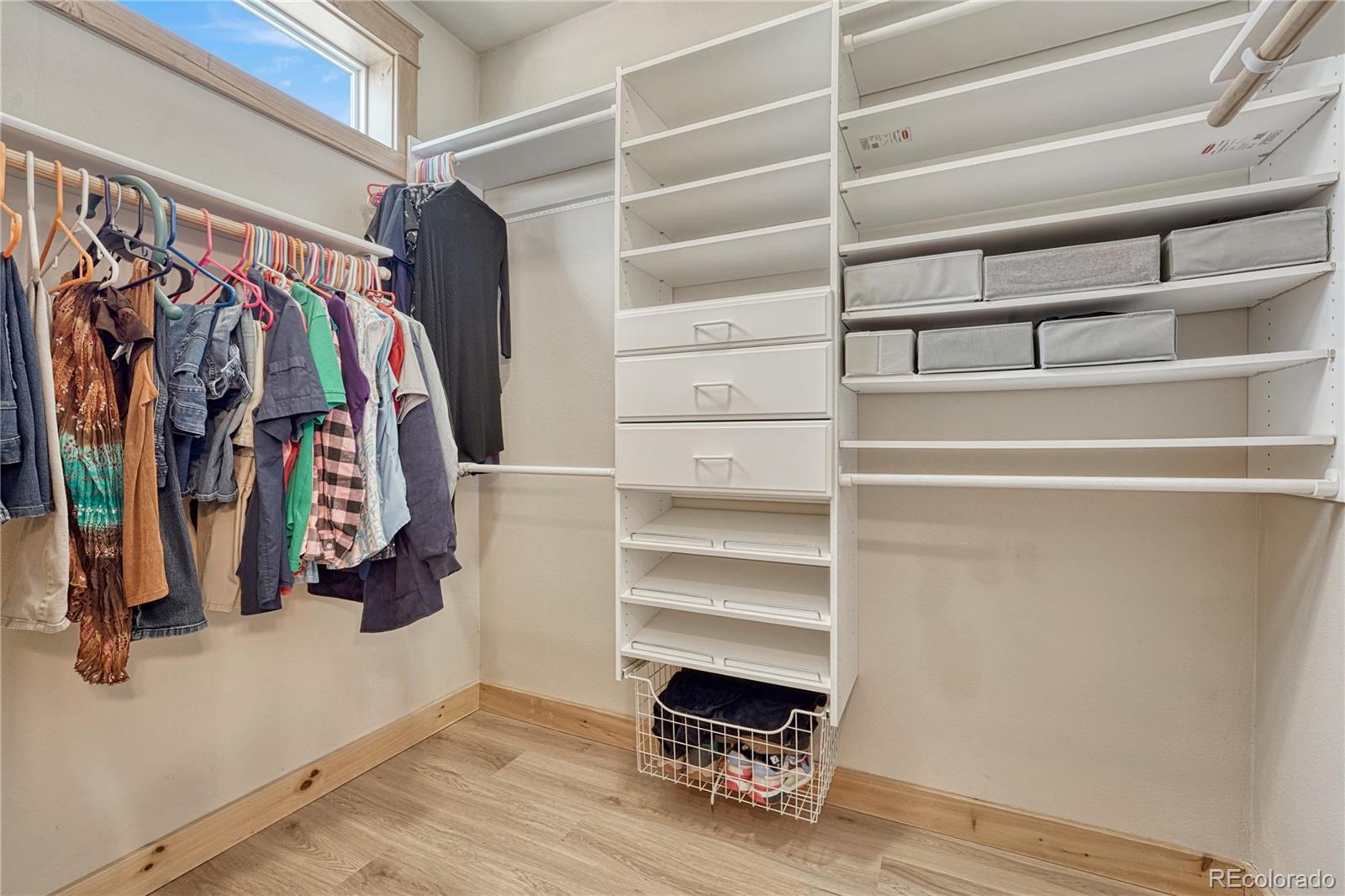 17355 Wagon Train Loop Peyton, CO 80831 - Photo 22 of 48 a view of walk in closet with clothes and shoes