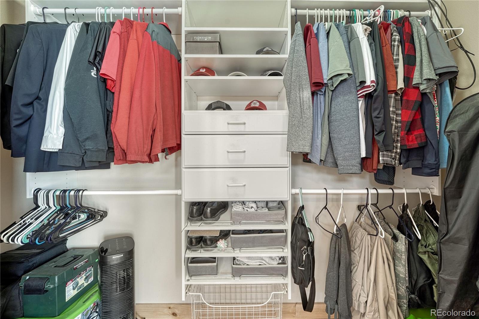 17355 Wagon Train Loop Peyton, CO 80831 - Photo 23 of 48 a view of walk in closet with clothes and shoes
