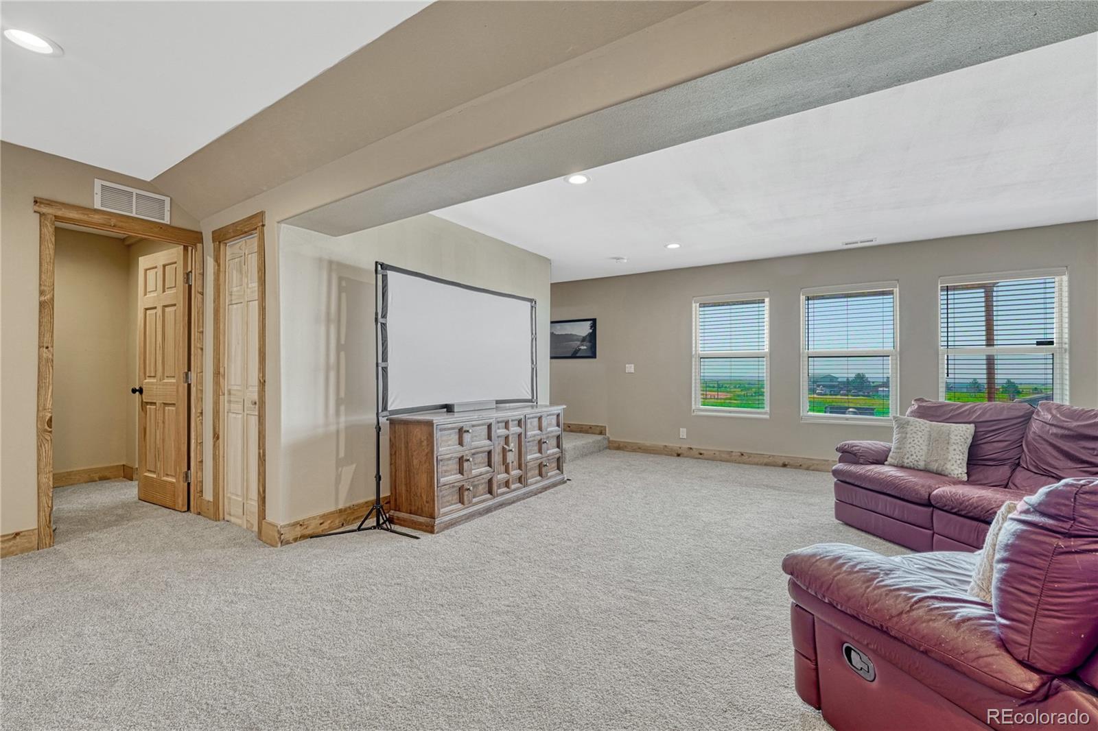 17355 Wagon Train Loop Peyton, CO 80831 - Photo 31 of 48 a living room with furniture and windows
