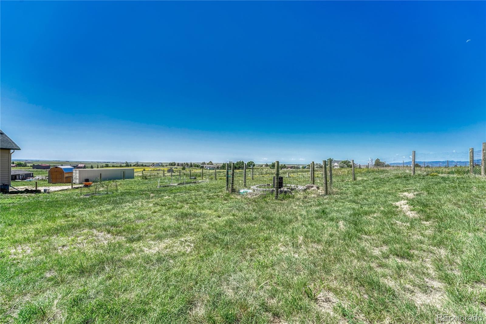 17355 Wagon Train Loop Peyton, CO 80831 - Photo 40 of 48 a view of a large green field with lots of green space