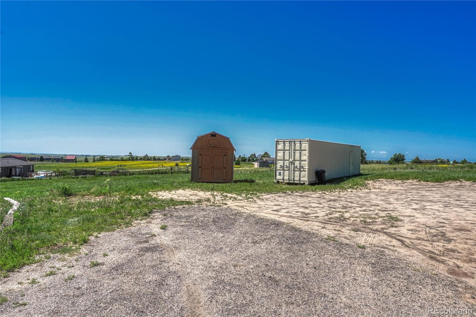 17355 Wagon Train Loop Peyton, CO 80831 - Photo 44 of 48 a backyard of a house with lots of green space